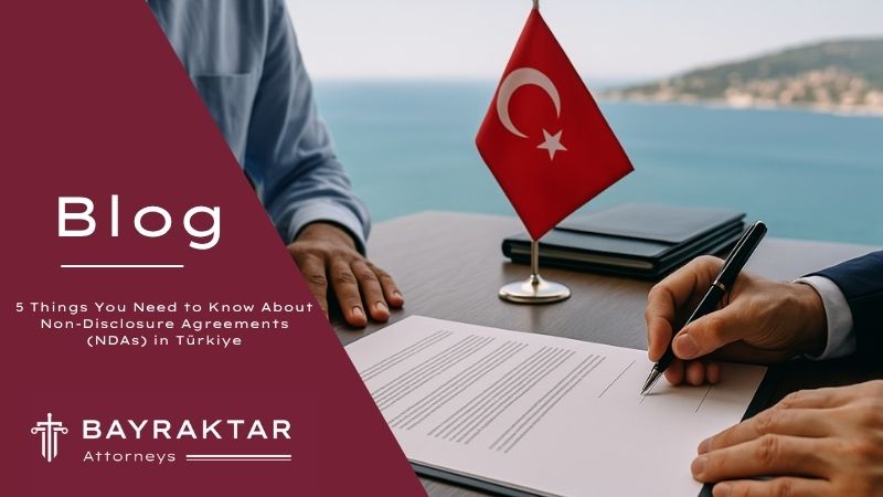 ["Two professionals signing an NDA at a table with a Turkish flag, overlooking the sea through a large window, representing international business in Türkiye.      Ask ChatGPT"]