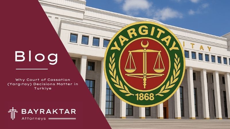 A high-resolution photograph of the Yargıtay Courthouse in Türkiye with the official emblem of the Turkish Court of Cassation (Yargıtay) centered over the steps and columns.
