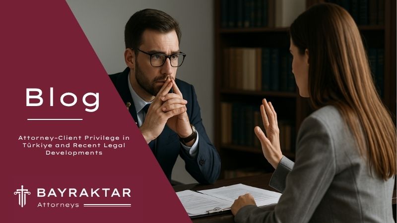 ["A photograph captures a male lawyer and a female client engaged in a confidential discussion at a desk, symbolizing lawyer-client confidentiality"]
