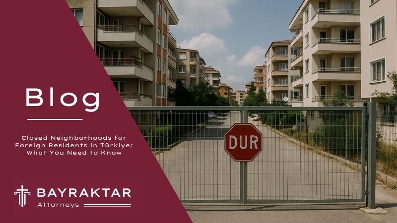 ["A gated residential neighborhood in Türkiye with apartment buildings and a stop sign, symbolizing neighborhoods closed to residence permits."]